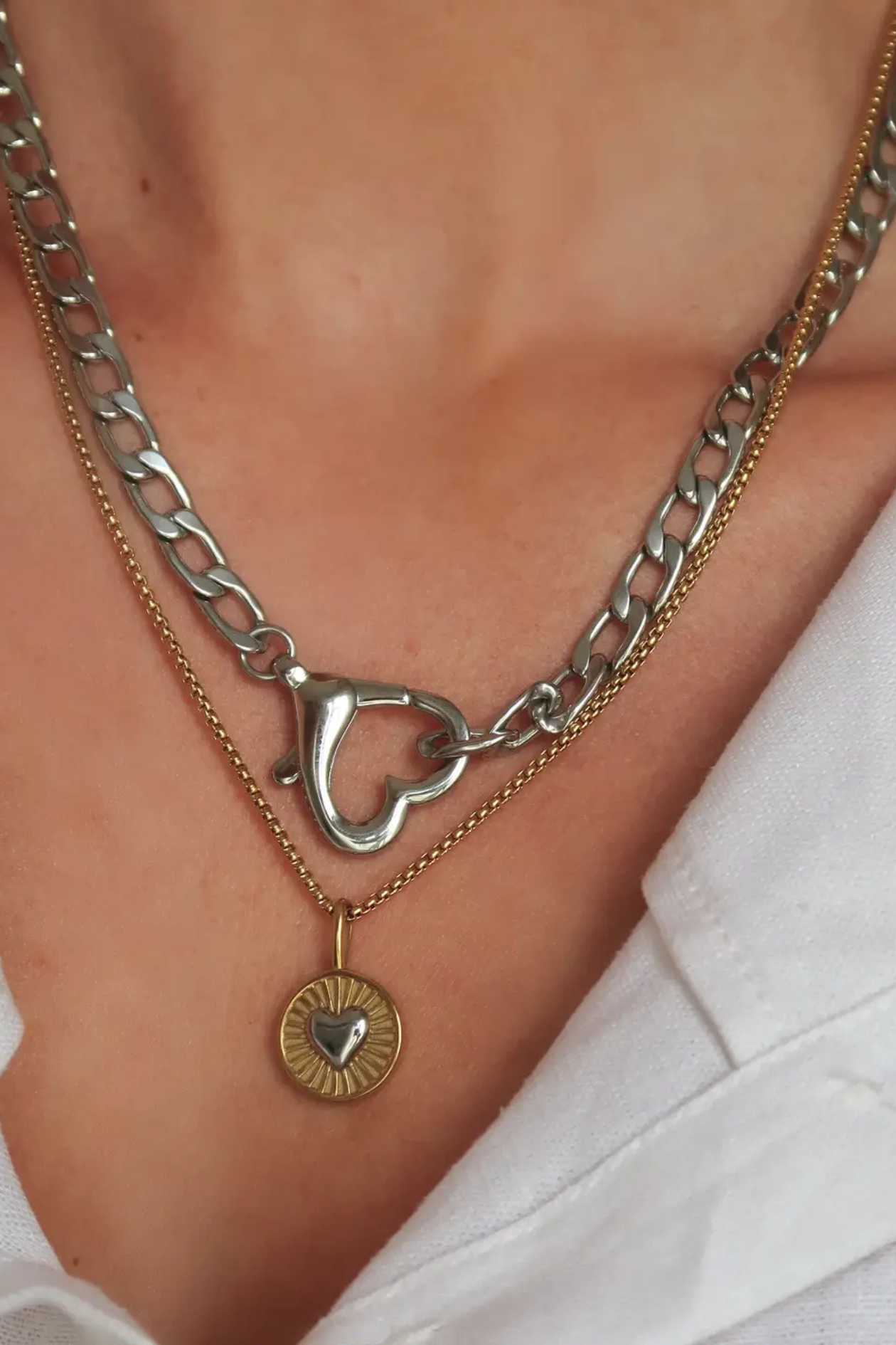 Gold Saiba Heart Clasp Necklace by Namaste Jewelry featuring a delicate shell pendant and secure clasp, elegant jewelry accessory.