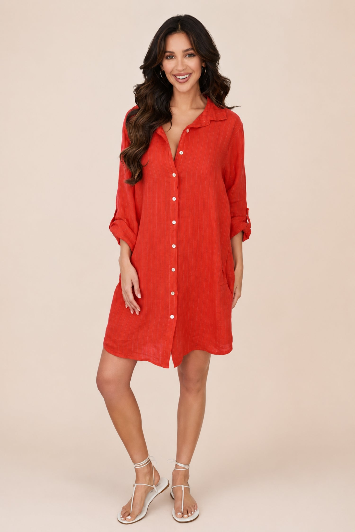 Italian linen pinstripe shirt dress by MILIO MILANO, featuring a relaxed fit and classic collar, shown on a model.