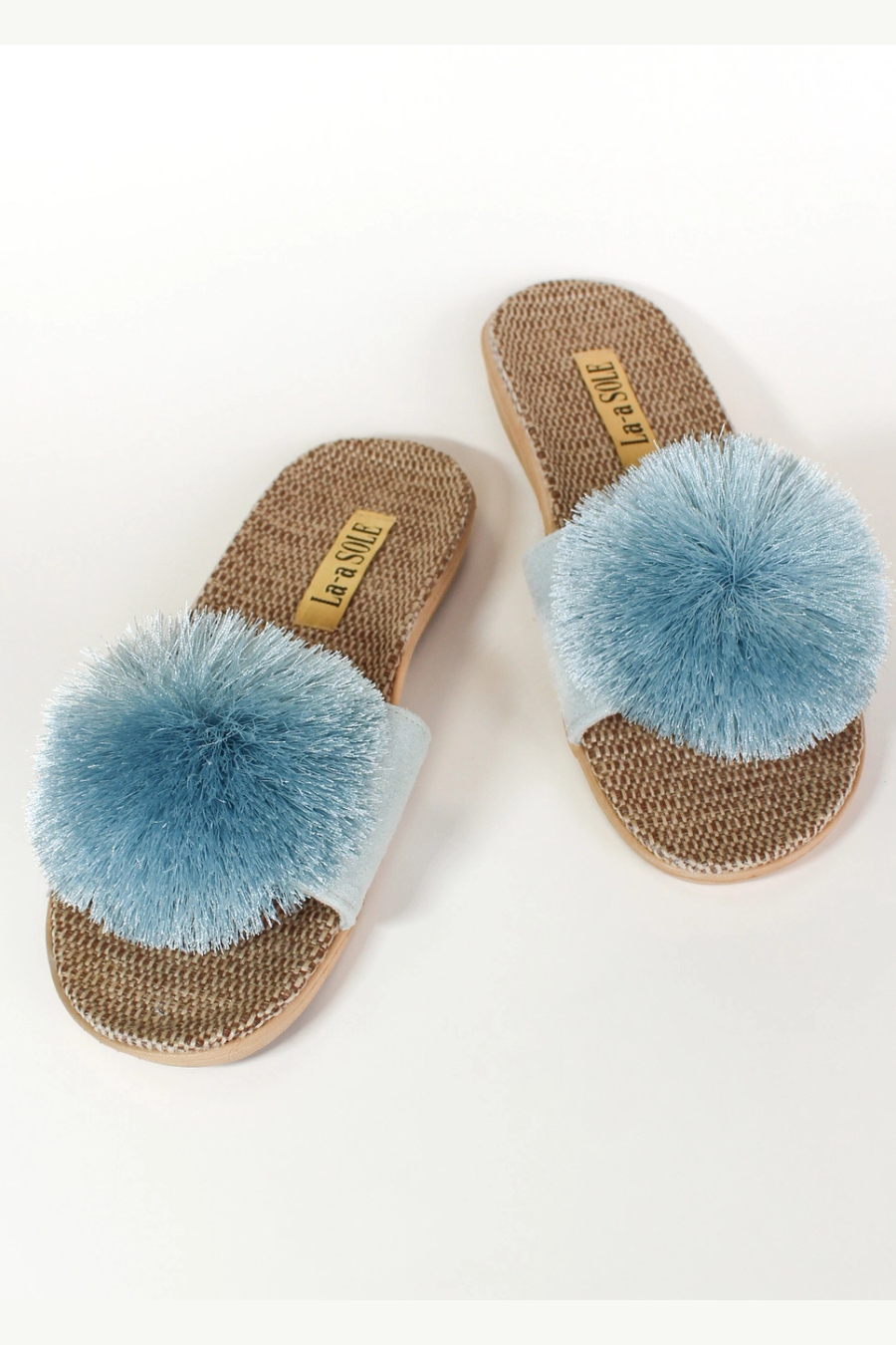 La-a SOLE Pom Pom Slides in vibrant colors, casual accessories with soft pom pom embellishments for stylish comfort.