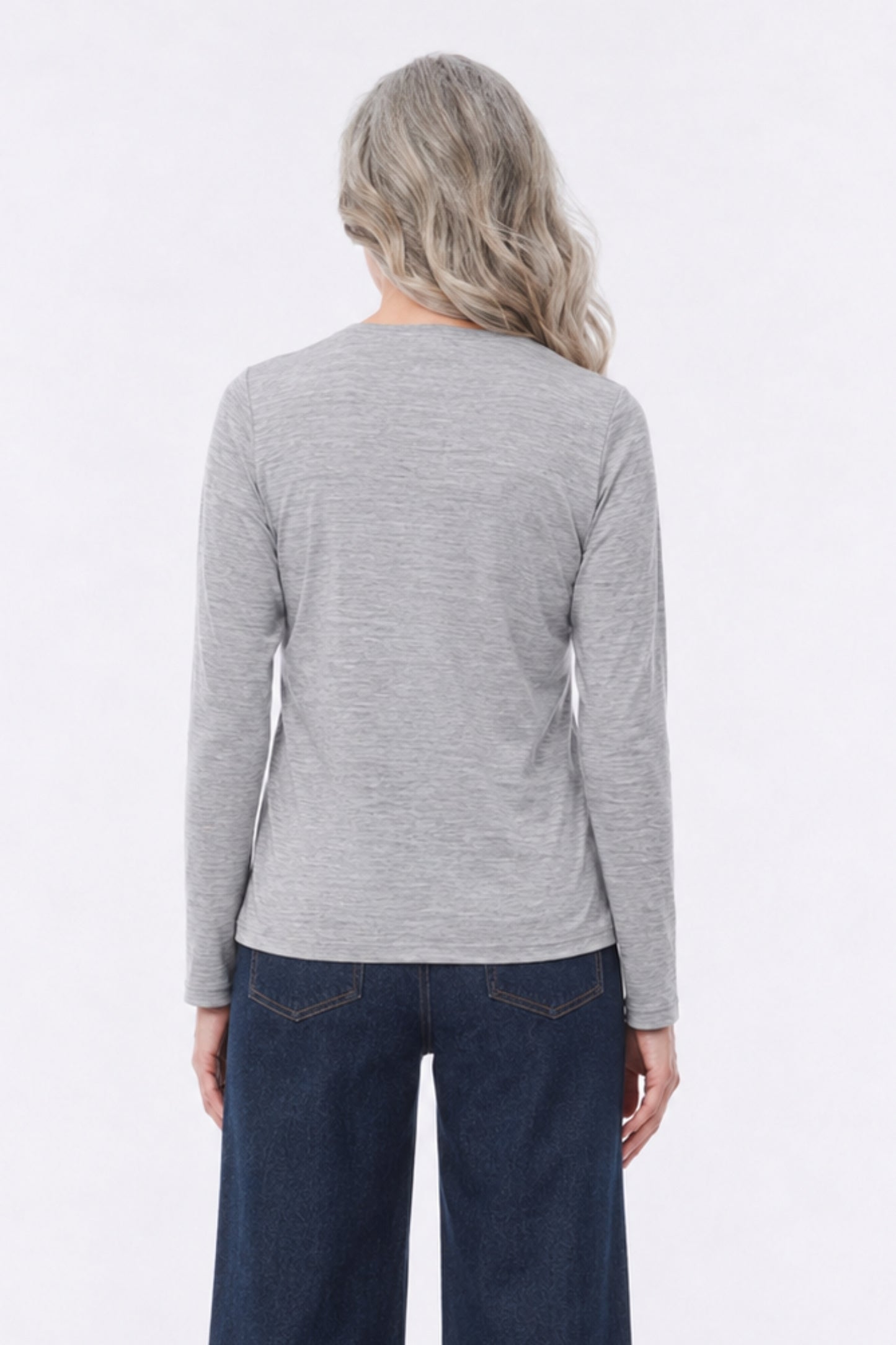 Model wearing the Albi 100% Merino Wool Long Sleeve Top in Grey Marl, back view