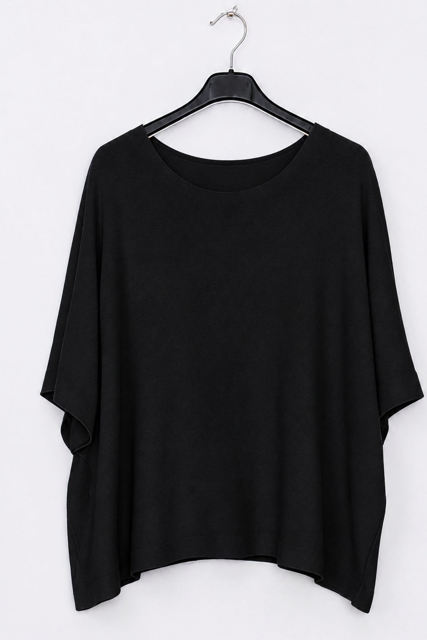 A black short-sleeve top with a wide boat neckline, hanging on a black hanger against a plain white background.