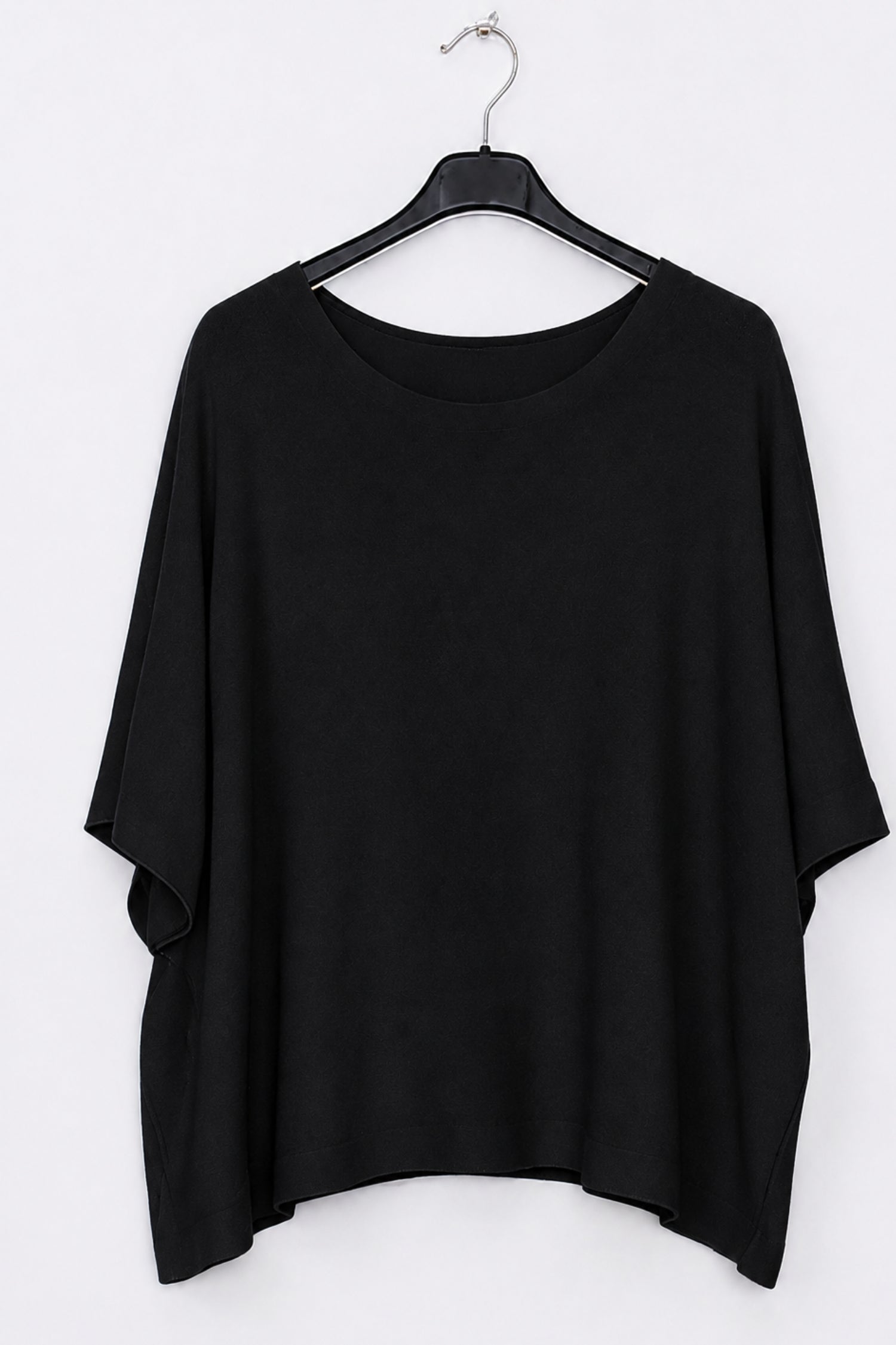 A black short-sleeve top with a wide boat neckline, hanging on a black hanger against a plain white background.