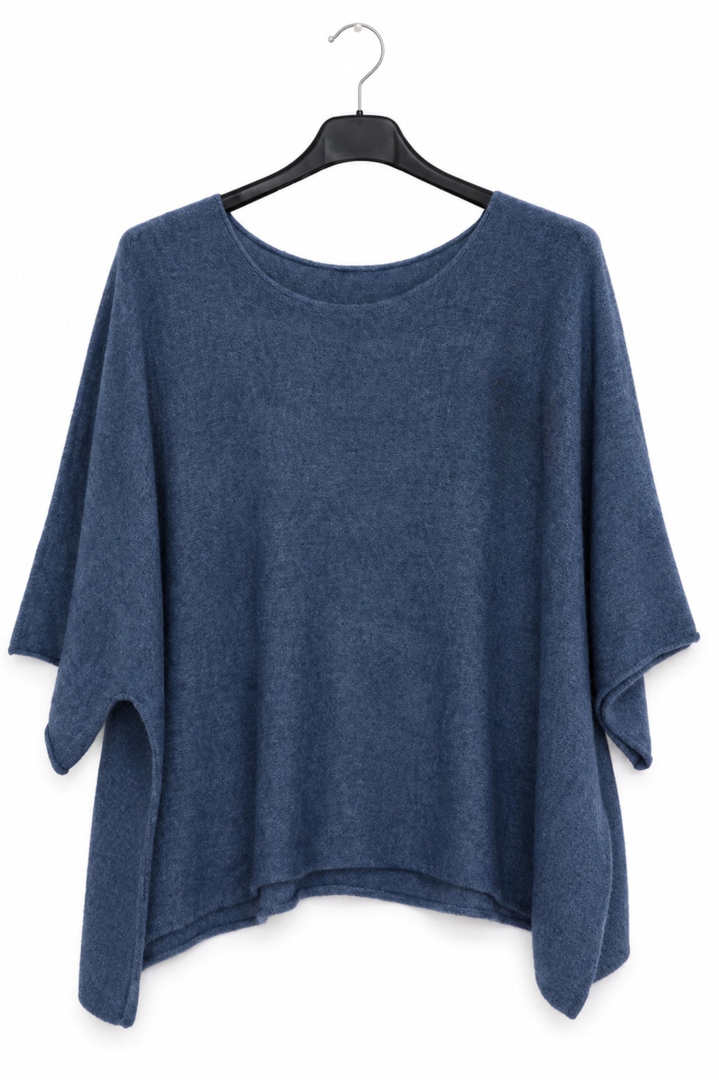 A blue knit poncho-style top with a round neckline and draped sleeves, hanging on a black hanger against a plain white background.