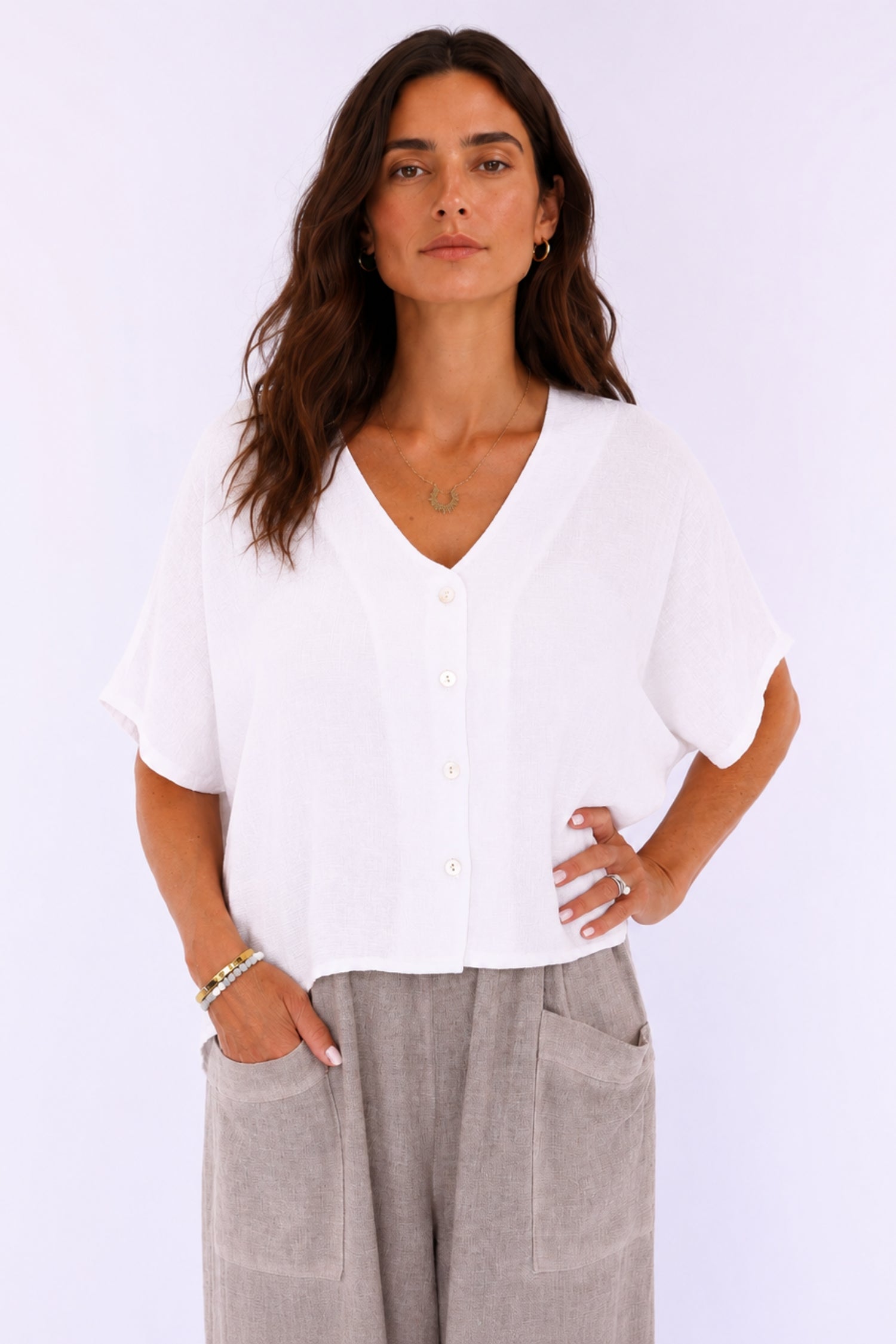 White linen and cotton blend short sleeve button-front top by Cadenza Italy Ltd, shown on a hanger.