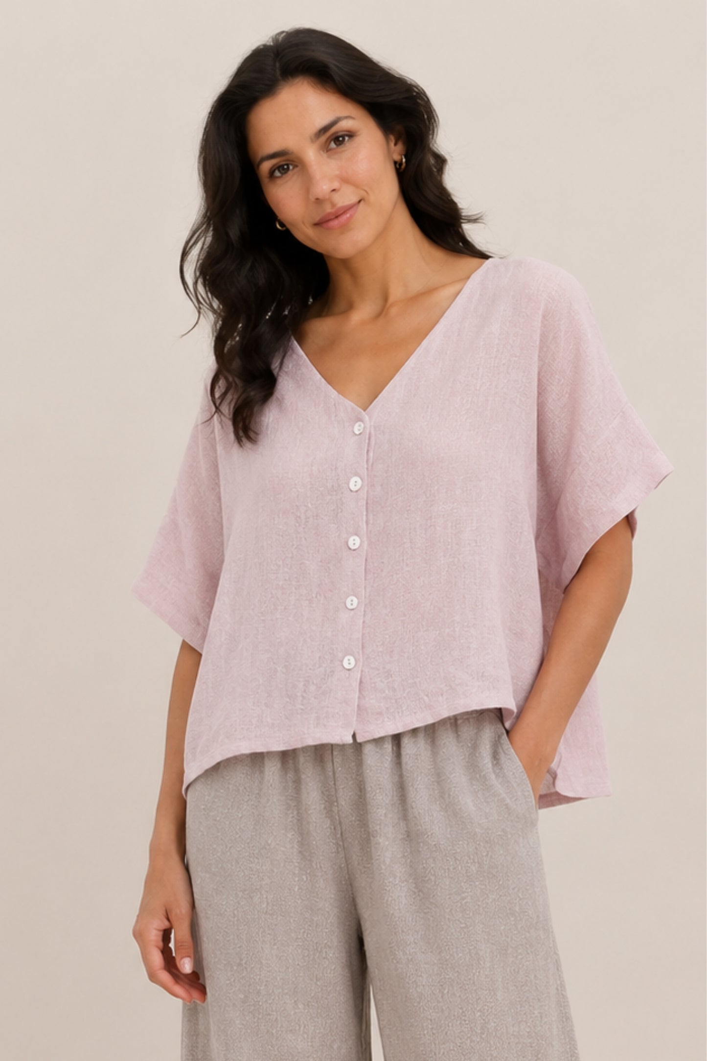 Blush linen and cotton blend short sleeve button-front top by Cadenza Italy Ltd, shown on a hanger.