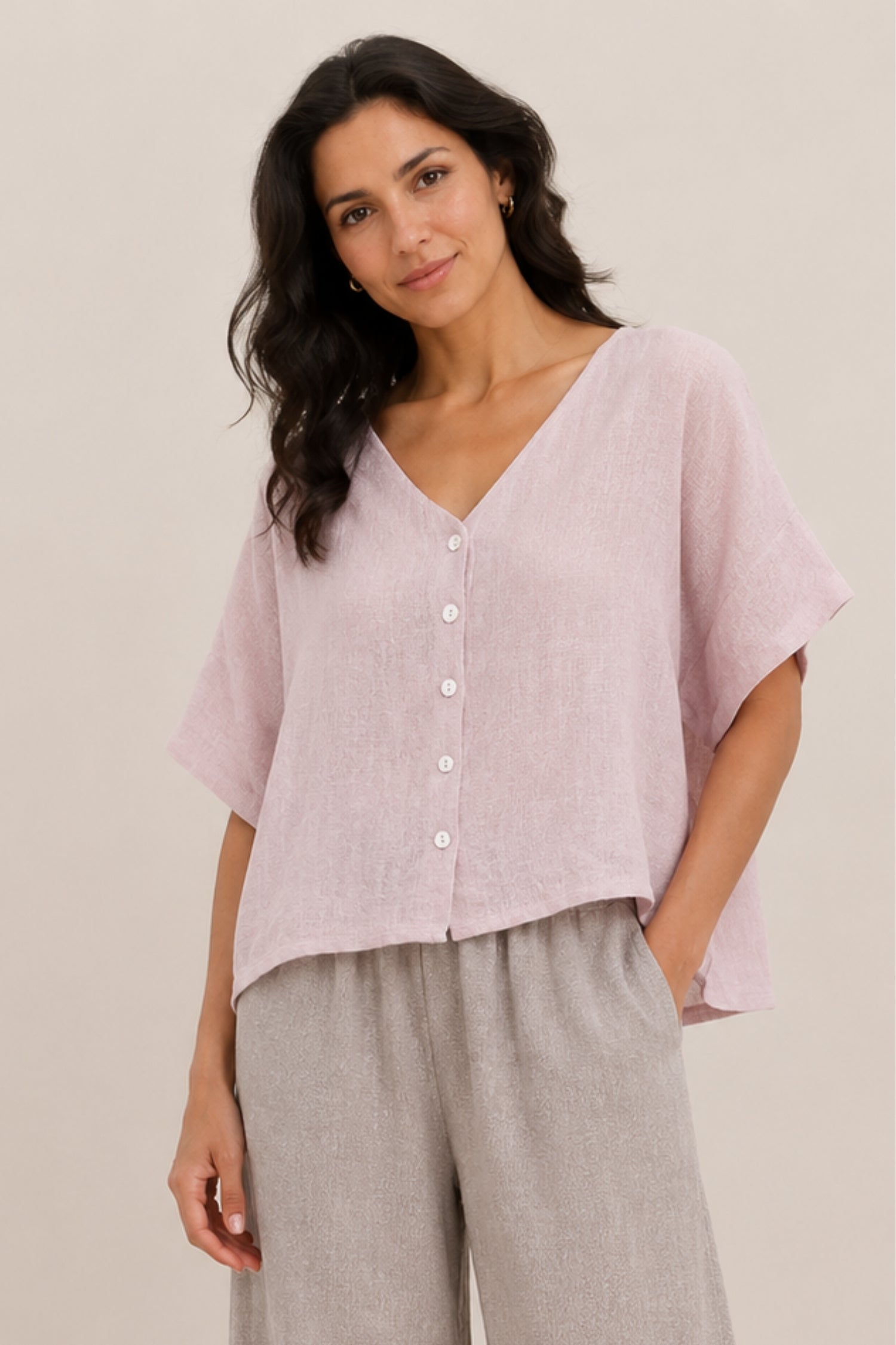 Blush linen and cotton blend short sleeve button-front top by Cadenza Italy Ltd, shown on a hanger.
