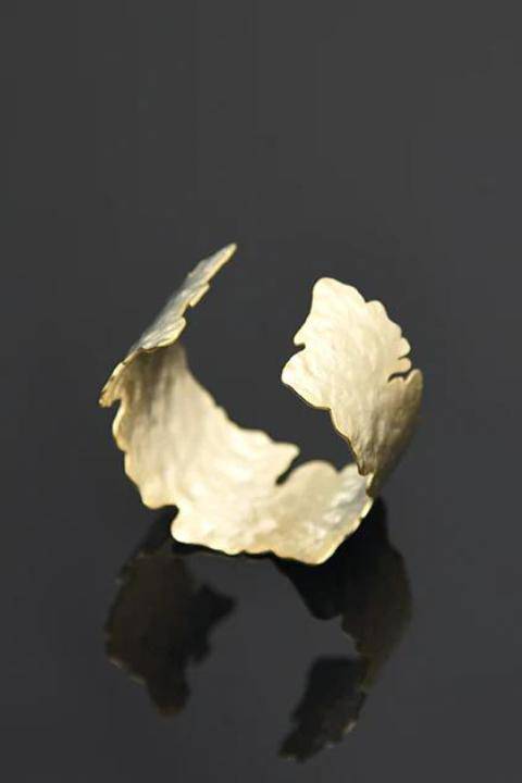 Satin gold Nova Bangle by Pursuits jewelry, showing a sleek, minimalist gold bracelet with a smooth finish.
